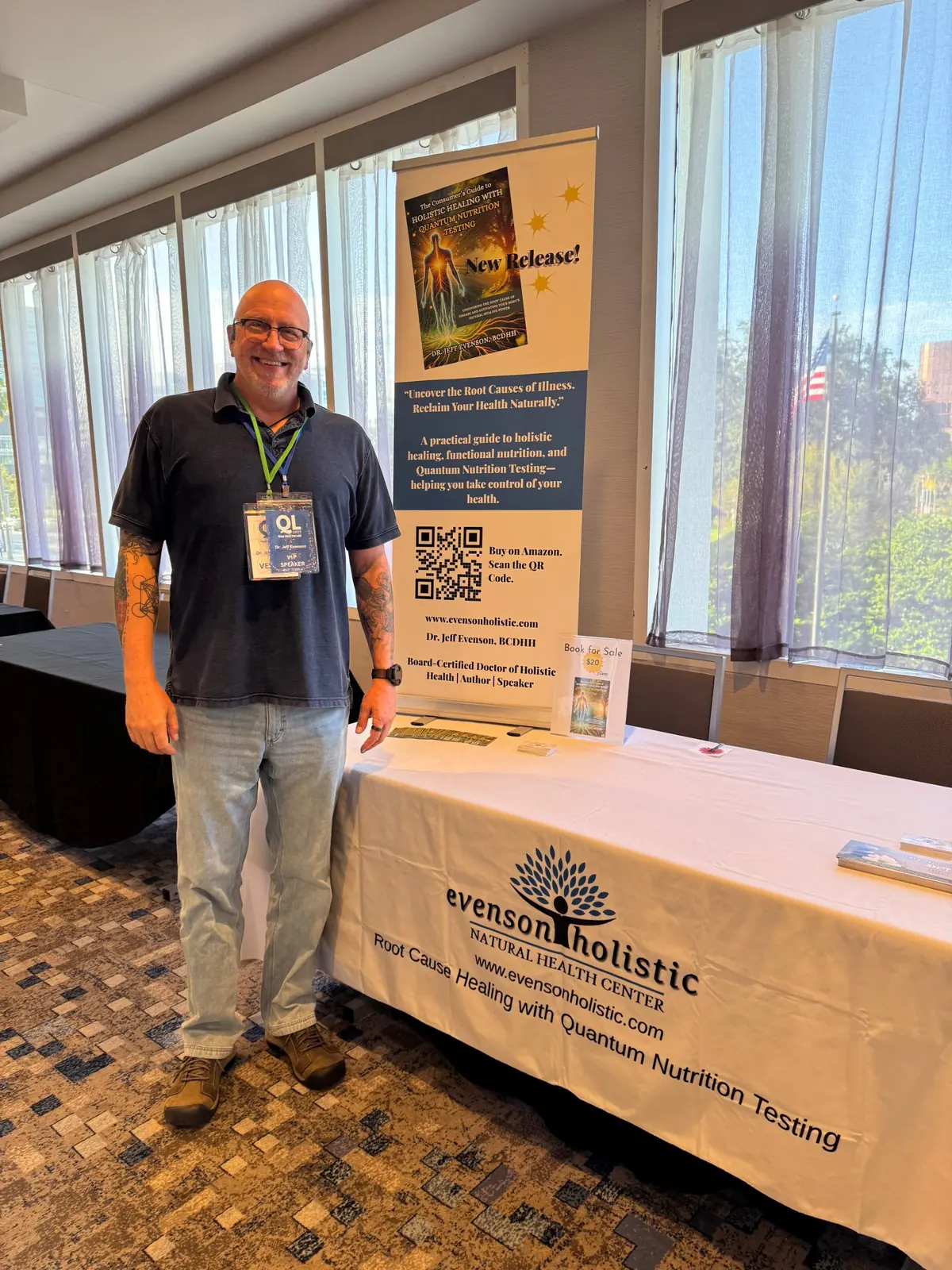 Jeff beside his book's banner at the Quantum Leap 2025 conference